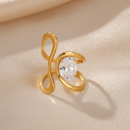 Bague Ellip en acier inoxydable doré avec design infini et zircon ovale - Minélia