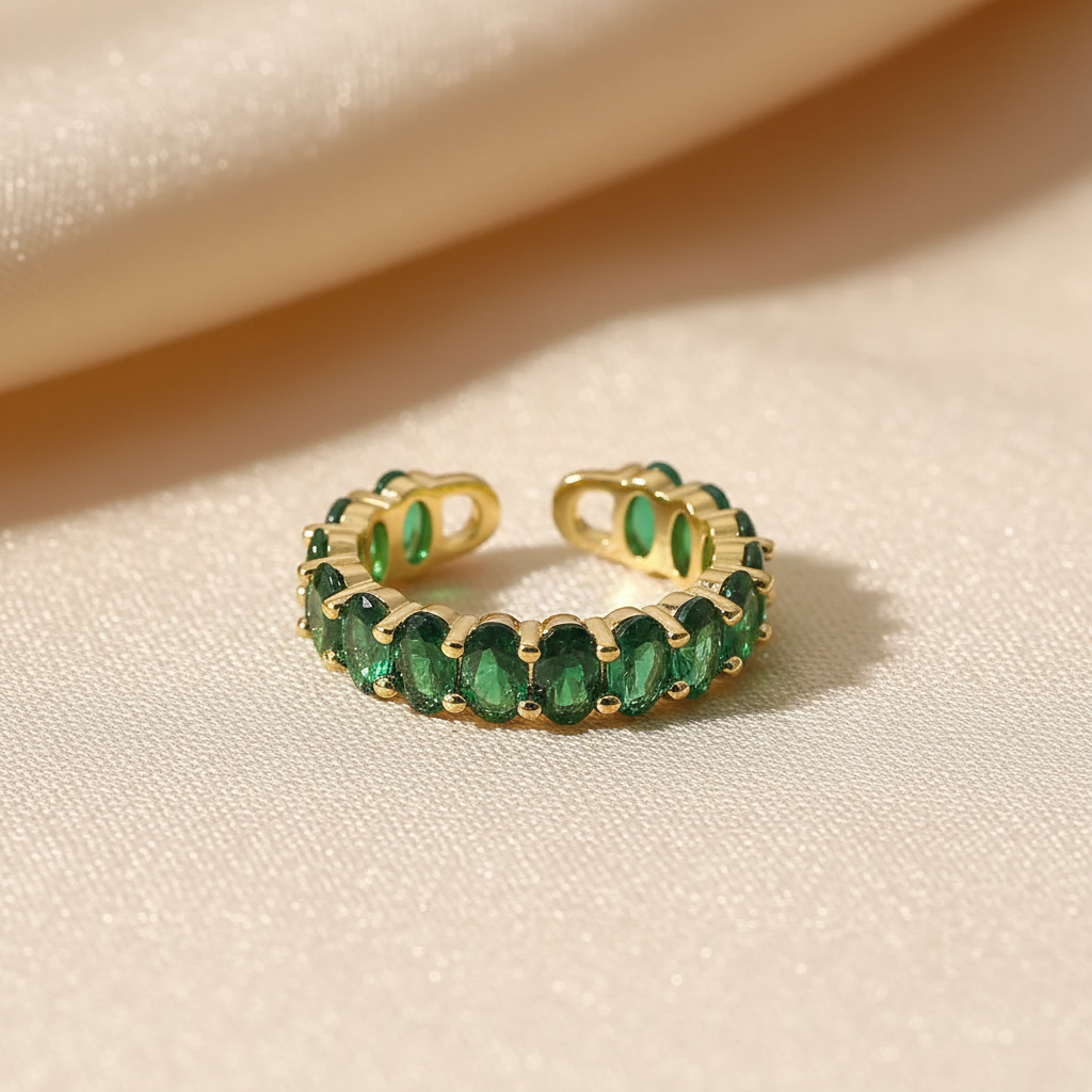 Bague Over en acier inoxydable doré avec zircons ovales vert émeraude - Minélia